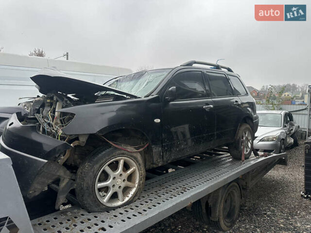 Черный Мицубиси Аутлендер, объемом двигателя 2.4 л и пробегом 240 тыс. км за 2200 $, фото 12 на Automoto.ua