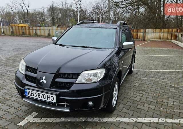 Черный Мицубиси Аутлендер, объемом двигателя 2.4 л и пробегом 167 тыс. км за 6150 $, фото 5 на Automoto.ua