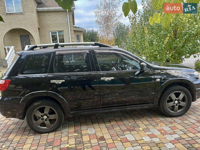 Чорний Міцубісі Аутлендер, об'ємом двигуна 2.38 л та пробігом 247 тис. км за 5499 $, фото 30 на Automoto.ua