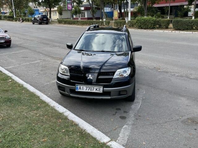 Черный Мицубиси Аутлендер, объемом двигателя 2 л и пробегом 297 тыс. км за 6500 $, фото 2 на Automoto.ua