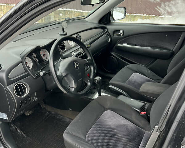 Чорний Міцубісі Аутлендер, об'ємом двигуна 2.4 л та пробігом 308 тис. км за 4700 $, фото 8 на Automoto.ua