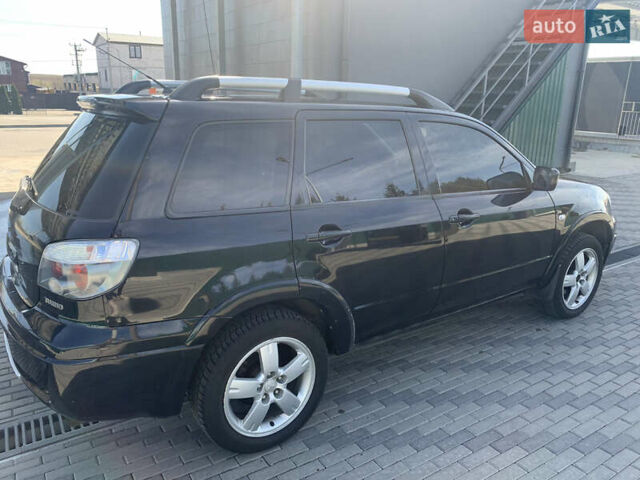 Черный Мицубиси Аутлендер, объемом двигателя 2 л и пробегом 212 тыс. км за 6000 $, фото 12 на Automoto.ua
