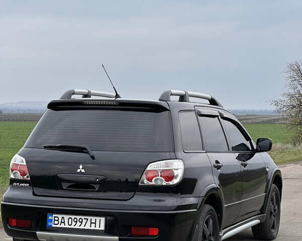 Черный Мицубиси Аутлендер, объемом двигателя 2 л и пробегом 230 тыс. км за 6300 $, фото 13 на Automoto.ua