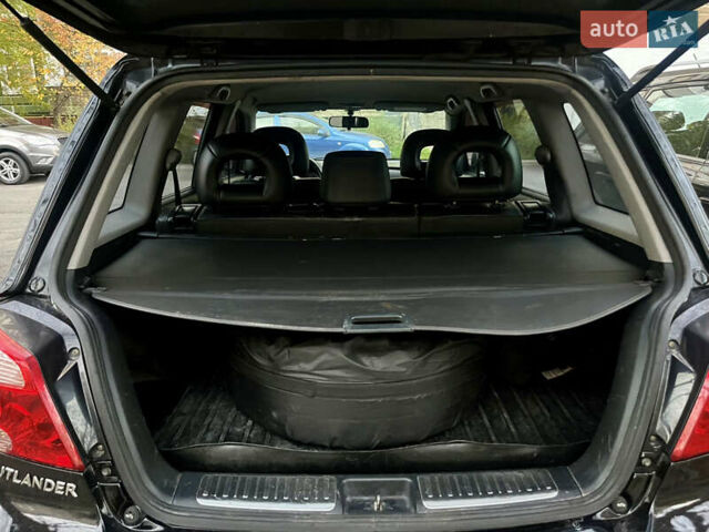 Чорний Міцубісі Аутлендер, об'ємом двигуна 2.38 л та пробігом 247 тис. км за 5499 $, фото 21 на Automoto.ua