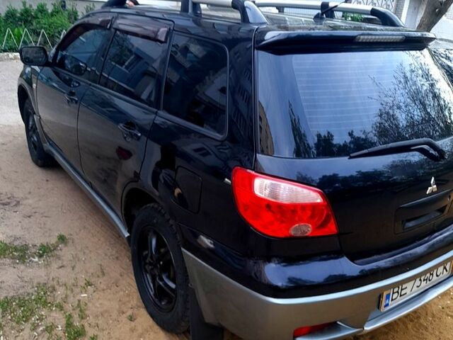 Черный Мицубиси Аутлендер, объемом двигателя 2 л и пробегом 226 тыс. км за 7000 $, фото 5 на Automoto.ua