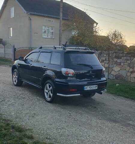 Міцубісі Аутлендер 2006 у Івано-Франківську на Automoto.ua Чорний Міцубісі Аутлендер, об'ємом двигуна 2 л та пробігом 263 тис. км за 7250 $, фото 17 на Automoto.ua