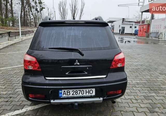 Черный Мицубиси Аутлендер, объемом двигателя 2.4 л и пробегом 167 тыс. км за 6150 $, фото 11 на Automoto.ua