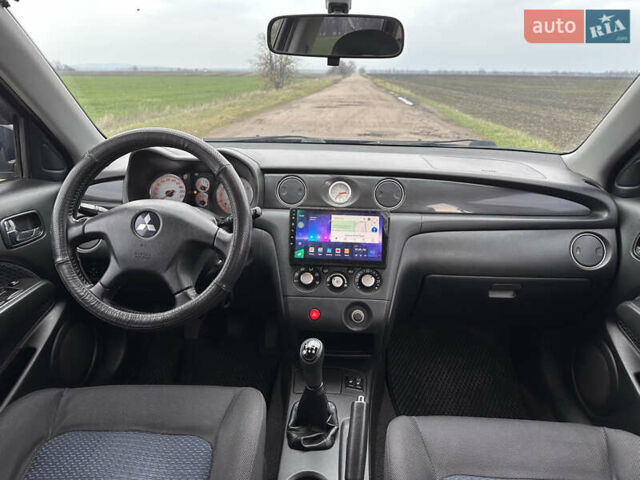 Черный Мицубиси Аутлендер, объемом двигателя 2 л и пробегом 230 тыс. км за 6300 $, фото 17 на Automoto.ua