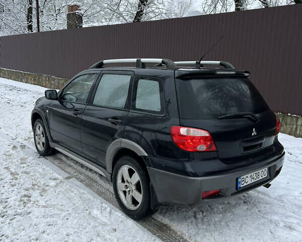 Чорний Міцубісі Аутлендер, об'ємом двигуна 2.4 л та пробігом 308 тис. км за 4700 $, фото 5 на Automoto.ua
