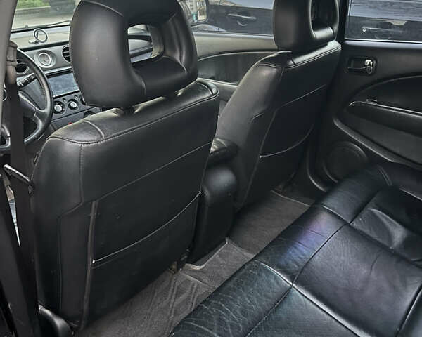 Чорний Міцубісі Аутлендер, об'ємом двигуна 2.38 л та пробігом 247 тис. км за 5499 $, фото 59 на Automoto.ua