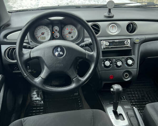 Чорний Міцубісі Аутлендер, об'ємом двигуна 2.4 л та пробігом 308 тис. км за 4700 $, фото 7 на Automoto.ua