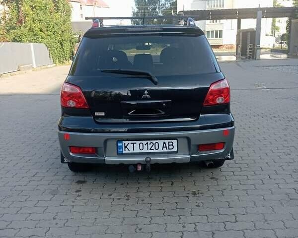 Черный Мицубиси Аутлендер, объемом двигателя 2 л и пробегом 297 тыс. км за 5800 $, фото 12 на Automoto.ua
