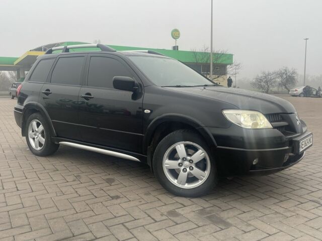 Чорний Міцубісі Аутлендер, об'ємом двигуна 2.4 л та пробігом 277 тис. км за 6700 $, фото 1 на Automoto.ua