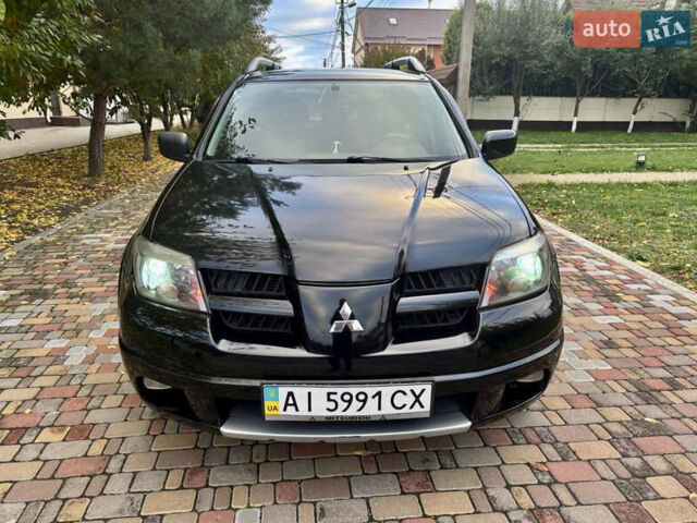 Чорний Міцубісі Аутлендер, об'ємом двигуна 2.38 л та пробігом 247 тис. км за 5499 $, фото 4 на Automoto.ua