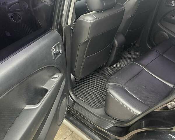 Черный Мицубиси Аутлендер, объемом двигателя 2.4 л и пробегом 277 тыс. км за 6700 $, фото 7 на Automoto.ua