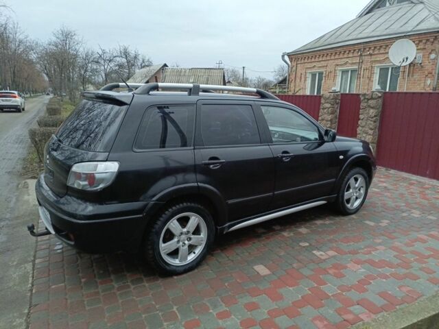 Черный Мицубиси Аутлендер, объемом двигателя 2 л и пробегом 200 тыс. км за 5100 $, фото 5 на Automoto.ua