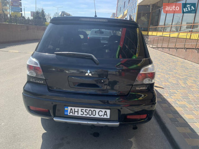 Черный Мицубиси Аутлендер, объемом двигателя 2 л и пробегом 212 тыс. км за 6000 $, фото 5 на Automoto.ua