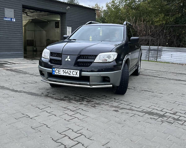 Черный Мицубиси Аутлендер, объемом двигателя 2 л и пробегом 280 тыс. км за 4999 $, фото 2 на Automoto.ua