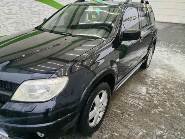 Чорний Міцубісі Аутлендер, об'ємом двигуна 2.4 л та пробігом 360 тис. км за 5200 $, фото 1 на Automoto.ua