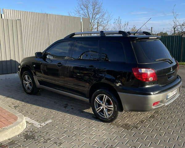 Чорний Міцубісі Аутлендер, об'ємом двигуна 2 л та пробігом 297 тис. км за 6200 $, фото 9 на Automoto.ua