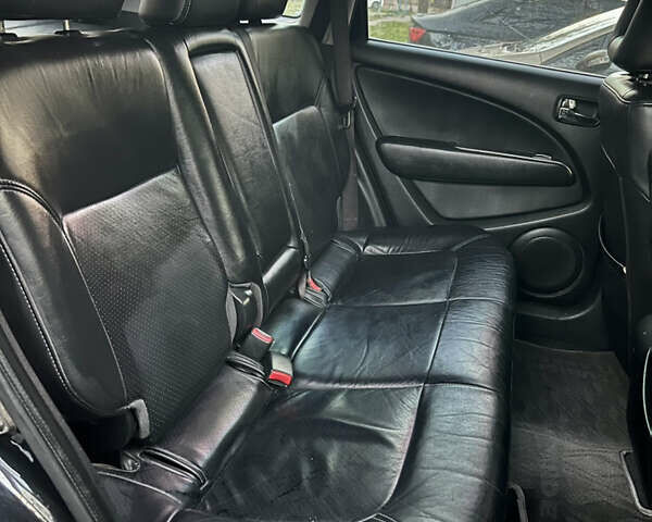 Чорний Міцубісі Аутлендер, об'ємом двигуна 2.38 л та пробігом 247 тис. км за 5499 $, фото 62 на Automoto.ua