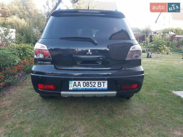Чорний Міцубісі Аутлендер, об'ємом двигуна 2.38 л та пробігом 221 тис. км за 6300 $, фото 9 на Automoto.ua