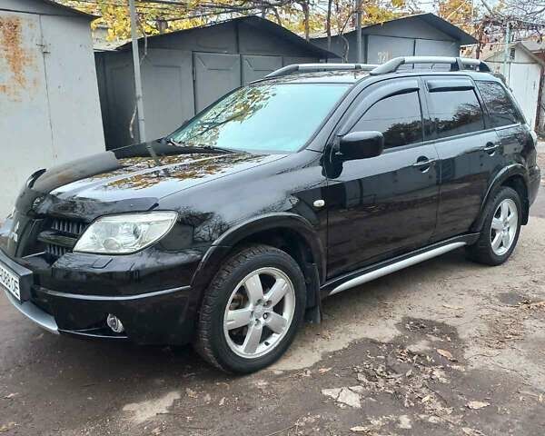 Черный Мицубиси Аутлендер, объемом двигателя 2.4 л и пробегом 256 тыс. км за 6900 $, фото 2 на Automoto.ua