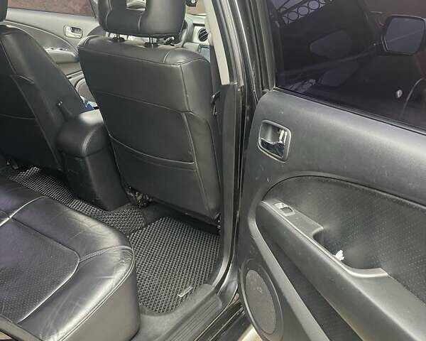 Черный Мицубиси Аутлендер, объемом двигателя 2.4 л и пробегом 277 тыс. км за 6700 $, фото 9 на Automoto.ua