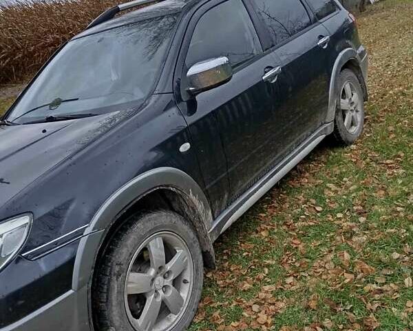 Чорний Міцубісі Аутлендер, об'ємом двигуна 2 л та пробігом 320 тис. км за 4500 $, фото 4 на Automoto.ua