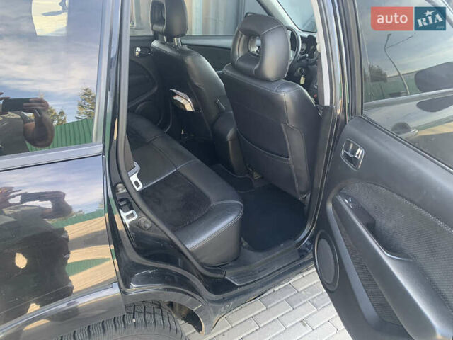 Черный Мицубиси Аутлендер, объемом двигателя 2 л и пробегом 212 тыс. км за 6000 $, фото 30 на Automoto.ua