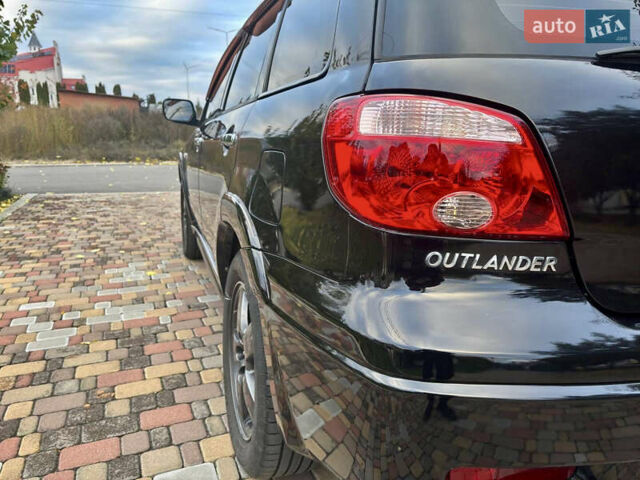Чорний Міцубісі Аутлендер, об'ємом двигуна 2.38 л та пробігом 247 тис. км за 5499 $, фото 15 на Automoto.ua