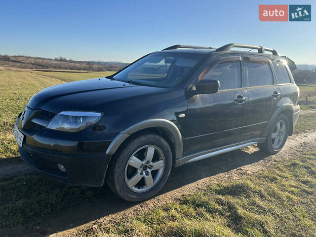 Черный Мицубиси Аутлендер, объемом двигателя 2.38 л и пробегом 230 тыс. км за 5350 $, фото 7 на Automoto.ua