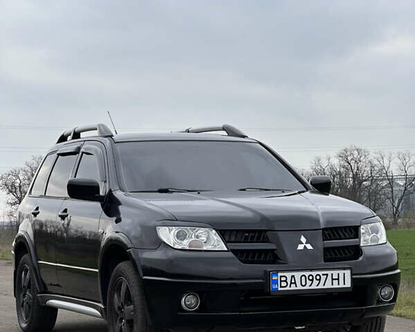 Черный Мицубиси Аутлендер, объемом двигателя 2 л и пробегом 230 тыс. км за 6300 $, фото 10 на Automoto.ua