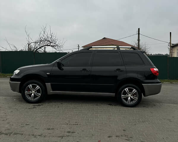 Чорний Міцубісі Аутлендер, об'ємом двигуна 2 л та пробігом 297 тис. км за 6200 $, фото 5 на Automoto.ua