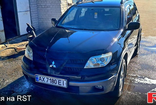 Черный Мицубиси Аутлендер, объемом двигателя 2.4 л и пробегом 185 тыс. км за 7500 $, фото 8 на Automoto.ua