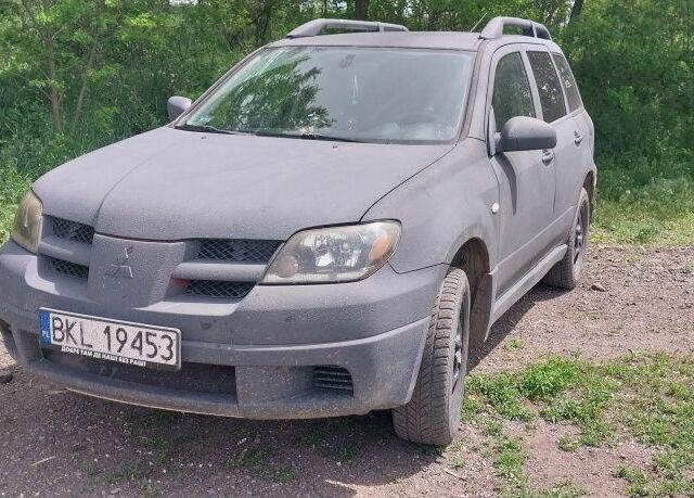 Чорний Міцубісі Аутлендер, об'ємом двигуна 2 л та пробігом 307 тис. км за 3000 $, фото 7 на Automoto.ua