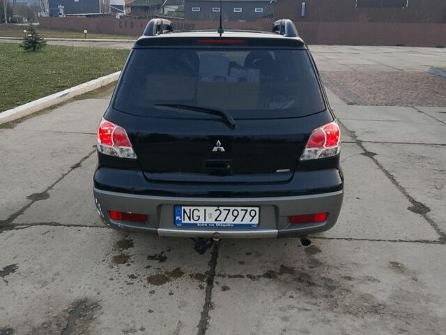 Черный Мицубиси Аутлендер, объемом двигателя 2 л и пробегом 169 тыс. км за 3500 $, фото 5 на Automoto.ua