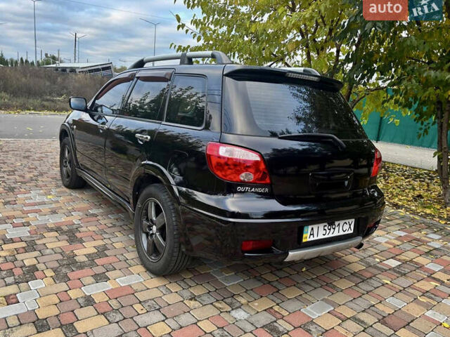 Чорний Міцубісі Аутлендер, об'ємом двигуна 2.38 л та пробігом 247 тис. км за 5499 $, фото 14 на Automoto.ua