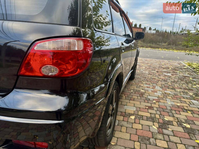 Чорний Міцубісі Аутлендер, об'ємом двигуна 2.38 л та пробігом 247 тис. км за 5499 $, фото 24 на Automoto.ua