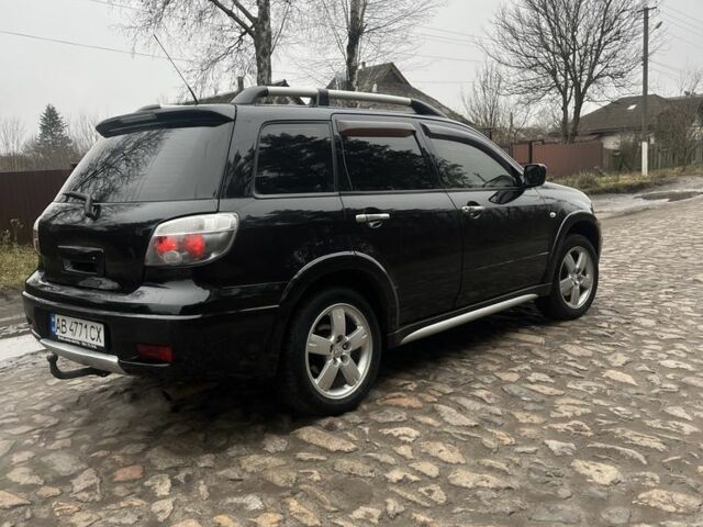 Черный Мицубиси Аутлендер, объемом двигателя 2.4 л и пробегом 310 тыс. км за 5300 $, фото 3 на Automoto.ua