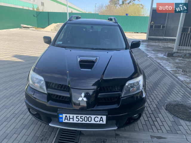 Черный Мицубиси Аутлендер, объемом двигателя 2 л и пробегом 212 тыс. км за 6000 $, фото 8 на Automoto.ua