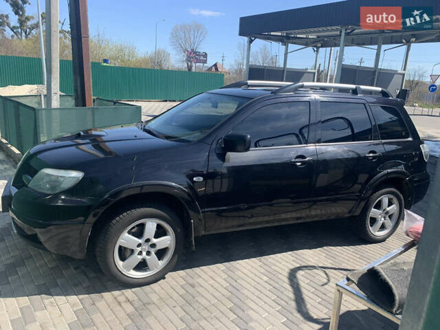 Черный Мицубиси Аутлендер, объемом двигателя 2 л и пробегом 212 тыс. км за 6000 $, фото 25 на Automoto.ua