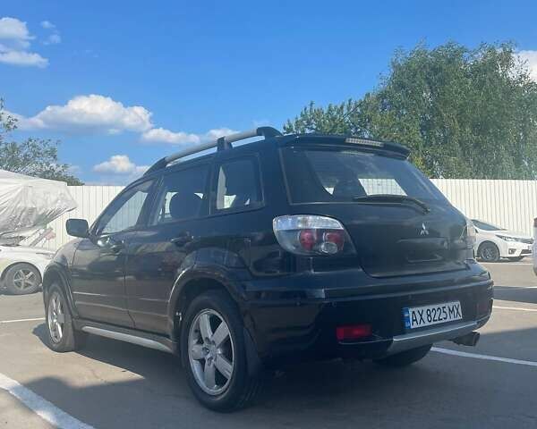 Черный Мицубиси Аутлендер, объемом двигателя 2.38 л и пробегом 260 тыс. км за 5000 $, фото 5 на Automoto.ua
