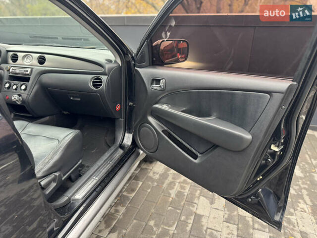 Черный Мицубиси Аутлендер, объемом двигателя 2.4 л и пробегом 242 тыс. км за 6800 $, фото 51 на Automoto.ua