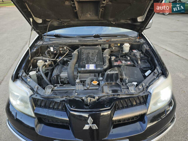 Чорний Міцубісі Аутлендер, об'ємом двигуна 2 л та пробігом 207 тис. км за 6900 $, фото 15 на Automoto.ua