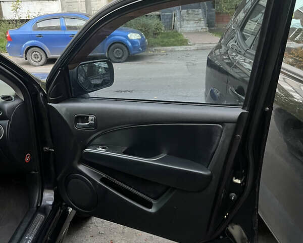 Чорний Міцубісі Аутлендер, об'ємом двигуна 2.38 л та пробігом 247 тис. км за 5499 $, фото 64 на Automoto.ua