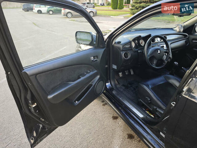 Чорний Міцубісі Аутлендер, об'ємом двигуна 2 л та пробігом 207 тис. км за 6900 $, фото 14 на Automoto.ua