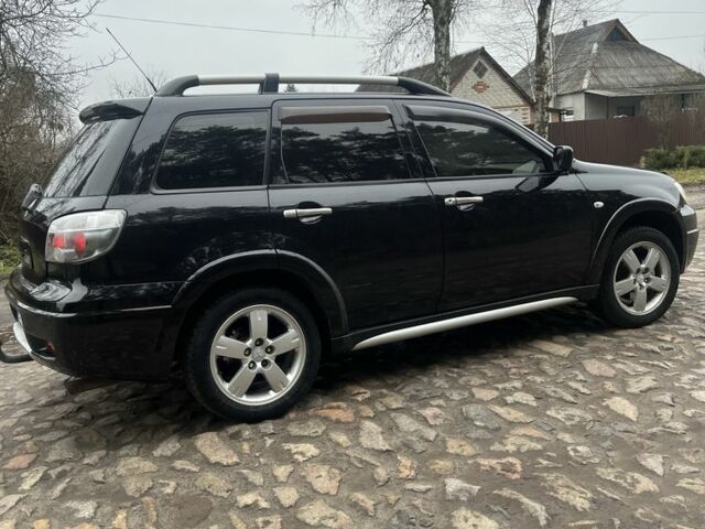 Черный Мицубиси Аутлендер, объемом двигателя 2.4 л и пробегом 310 тыс. км за 5300 $, фото 4 на Automoto.ua
