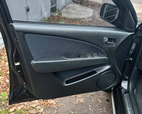 Черный Мицубиси Аутлендер, объемом двигателя 2.4 л и пробегом 256 тыс. км за 6900 $, фото 11 на Automoto.ua