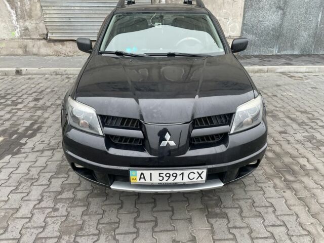 Черный Мицубиси Аутлендер, объемом двигателя 2.4 л и пробегом 234 тыс. км за 5499 $, фото 18 на Automoto.ua